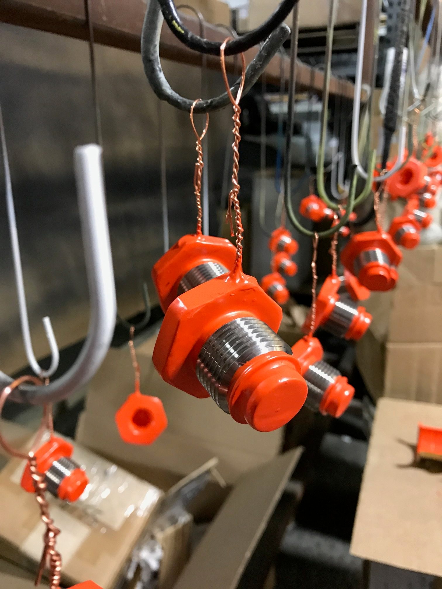 Masked parts on plating rack — selective coating for precision finishing